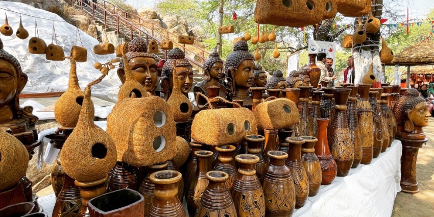 Colourful and vibrant handicrafts are on display in a crafts fair during the daytime.