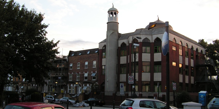 Exterior view of Finsbury Park Mosque, showcasing its beautiful modern architecture with the minarets