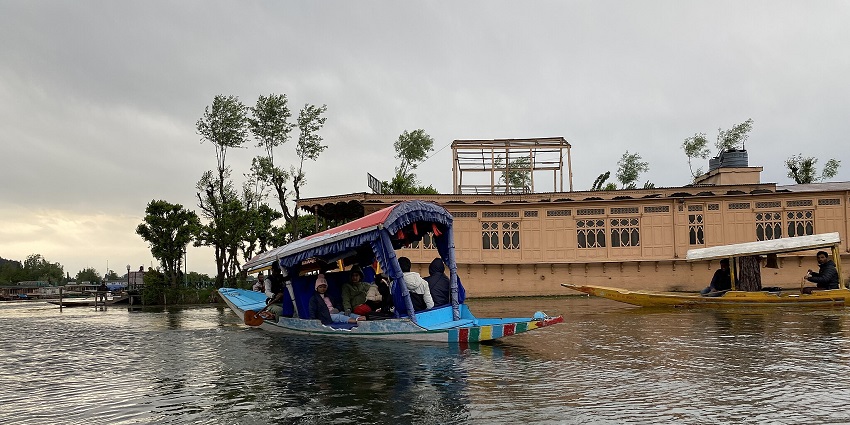 A floating hotel houseboat with modern facilities and multi-story design.