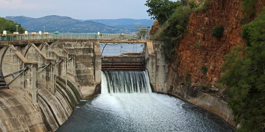 A peaceful view of Gadeshwar Dam with lush green hills near Kharghar