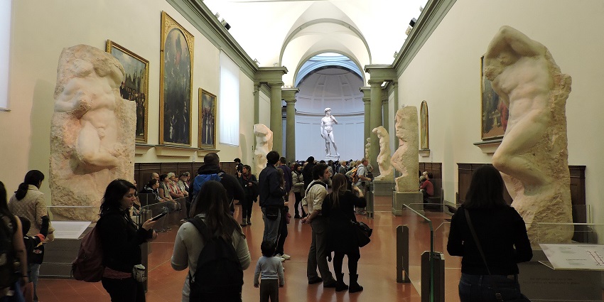 Gallery in the Accademia in Florence, with Michelangelo’s unfinished sculptures and David statue.