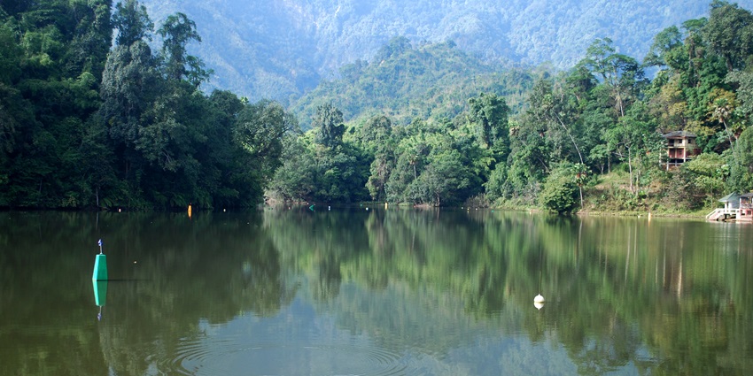 Green-watered Ganga Lake at Arunachal Pradesh is surrounded by lush green mountains.