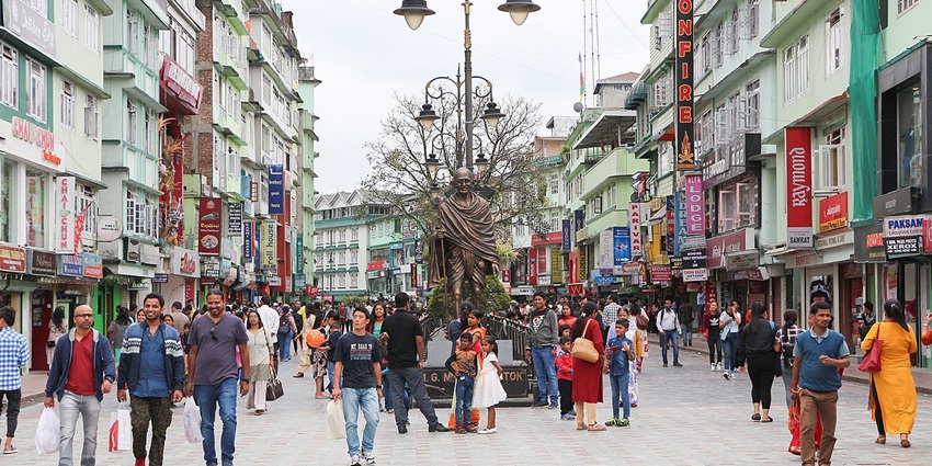 A panoramic view of M.G Marg, in Gangtok, covered in mist with the Himalayan backdrop.