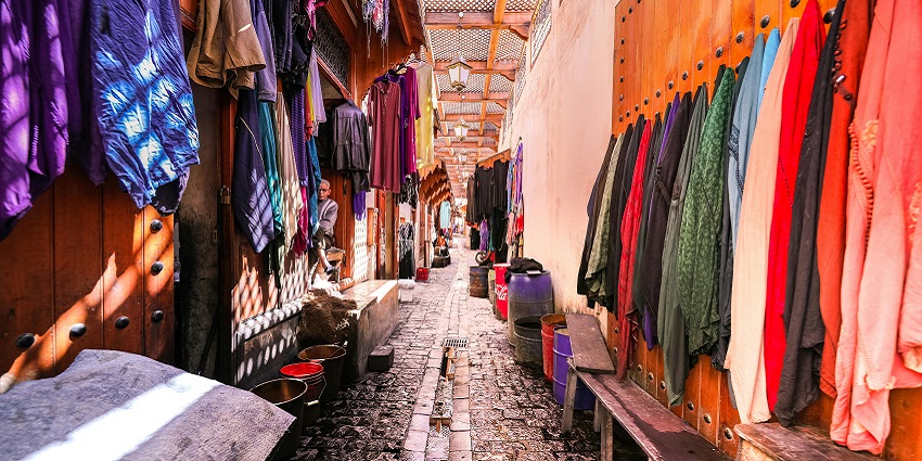 An image of a boutique market with variety of clothes, resembling the Garosu shopping vibe
