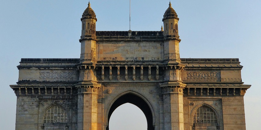The panoramic picture of the Gateway of India where tourists are exploring and taking pictures