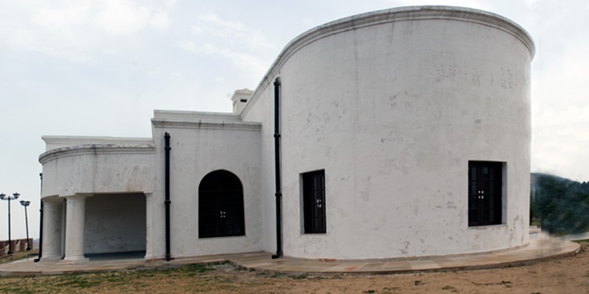 Historic George Everest House in Mussoorie, overlooking green hills and misty valleys