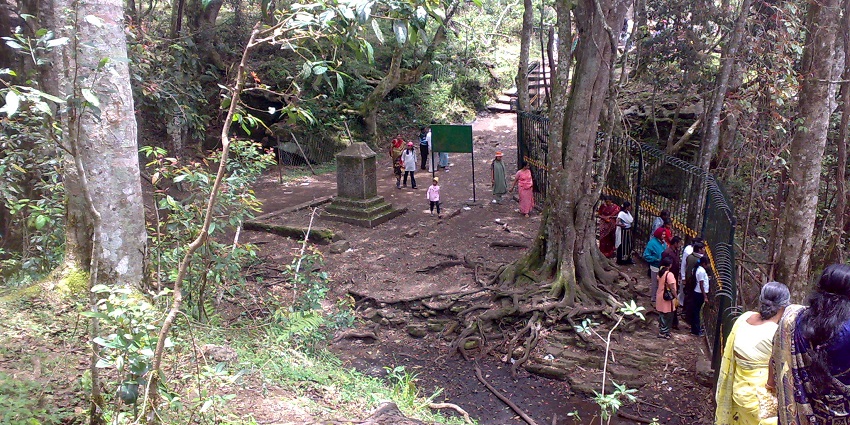 A picture of Guna Caves surrounded by eerie mist and forest, offering an adventurous feel.