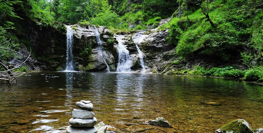 A picture of the serene Ghagra Waterfall surrounded by lush green forests in Jhargram.