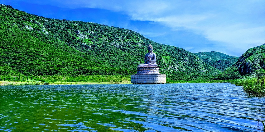 A peaceful Image view of Ghora Katora Lake surrounded by lush greenery.
