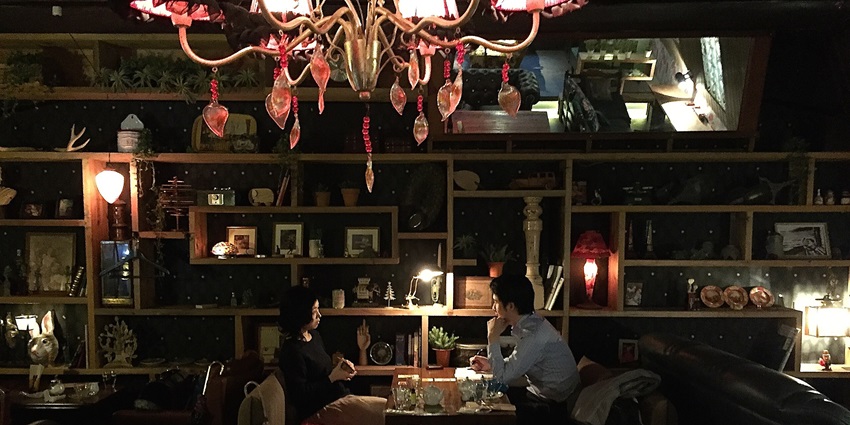 A dimly lit hidden speakeasy in Ginza, serving craft cocktails in an intimate setting