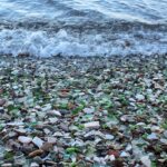 Colourful Glass Beach in Russia with smooth, polished glass pebbles.