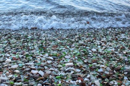 Colourful Glass Beach in Russia with smooth, polished glass pebbles.