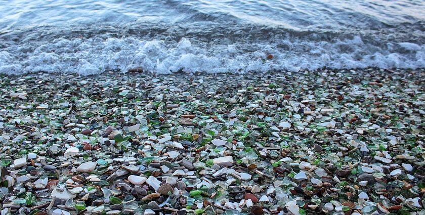 Colourful Glass Beach in Russia with smooth, polished glass pebbles.