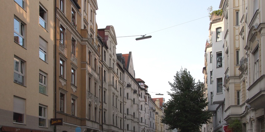 View along Munich’s HansSachsStraße in Glockenbachviertel showcasing and street life