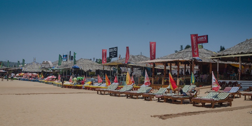 An image of Goa's Baga Beach, one of the places to visit in India for couples, at sunset