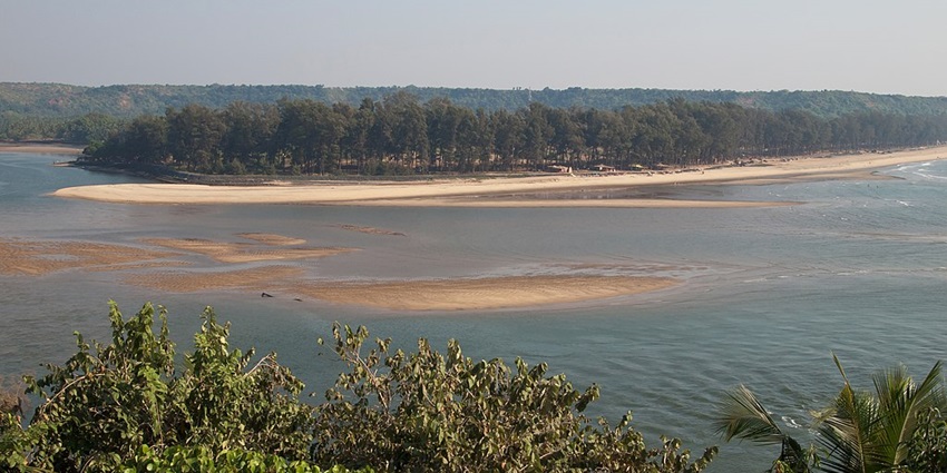 An image of panoramic view of the Terekhol River and Querim Beach in Goa in South India
