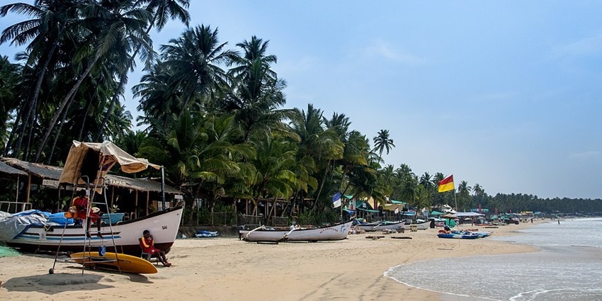 An image of Palolem Beach, Goa, one of the popular places to visit in October with family in India.