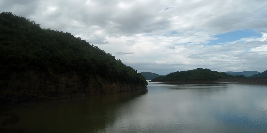 Image of a river valley around lush greenery which is Yeleru dam reservoir at Yeleswaram, East Godavari