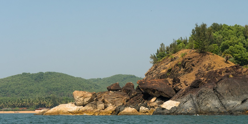 An image showing Om Beach in Gokarna, Karnataka, with its scenic coastline and calm atmosphere.