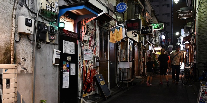 Tokyo Nightlife experience at Golden Gai, showcasing charming, old-style bars in narrow alleys