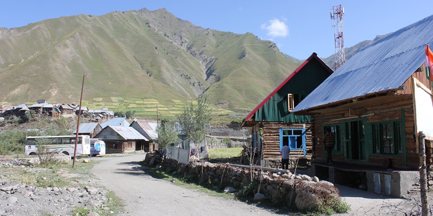 A scenic view of a lush green valley in Kashmir, which is one of the most offbeat places in India