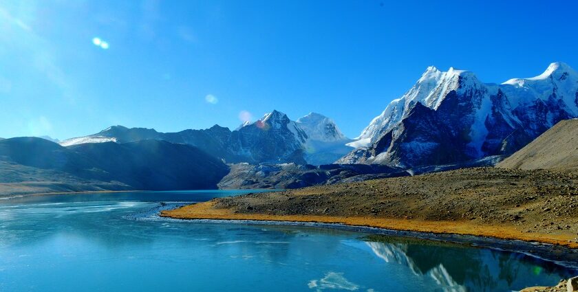 Sikkim’s Gurudongmar Lake in April with Sanglaphu and Gurdongmar mountains in the background.