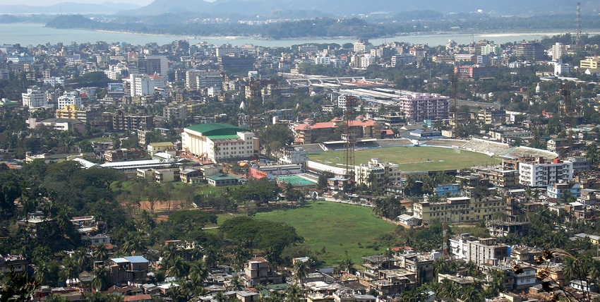 An aerial view of Guwahati, Assam, India, showing a densely populated city with buildings