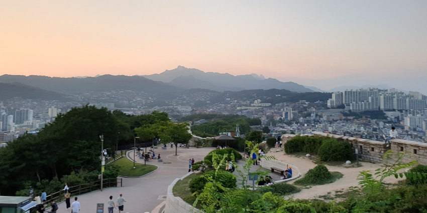Historic market, cultural palace, and scenic park in Seoul.