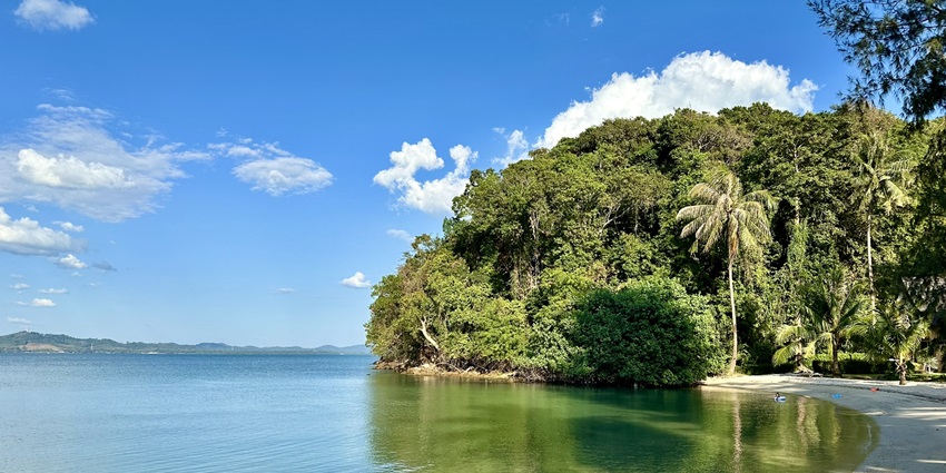 Halfmoon Beach, a secluded beach with calm waters and stunning natural magnificence.