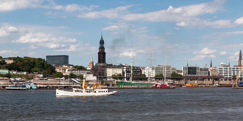 A view of Hamburg's Landungsbrücken, a bustling waterfront area with historic piers.