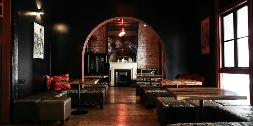 Relaxing ambience inside Hang Out Plus with chic furniture and a welcoming atmosphere.