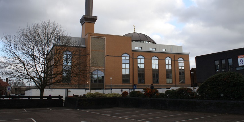 The grand façade of Harrow Central Mosque, showcasing its domes and towering minaret
