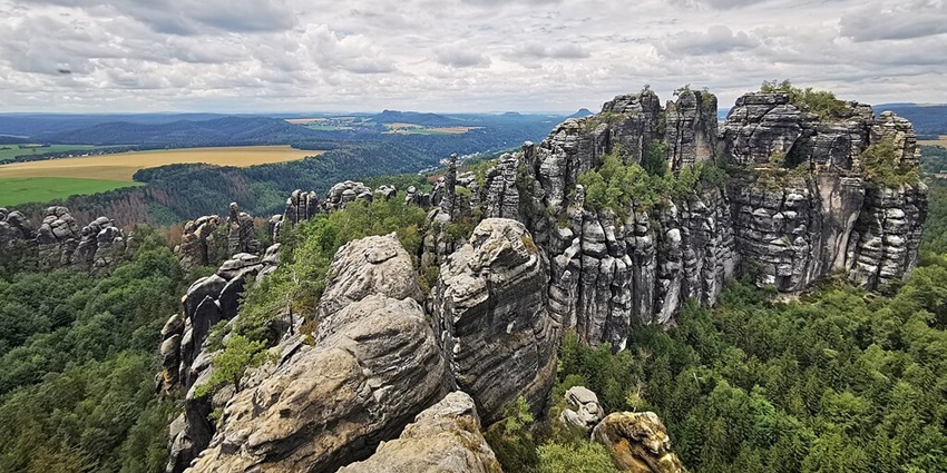 An image showing a view of the Saxon Switzerland National Park, a famous place to visit in Germany.