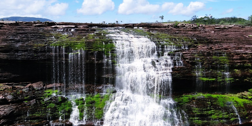 The beautiful El Sapo Waterfalls with a blue sky backdrop at the Canaima National Park.