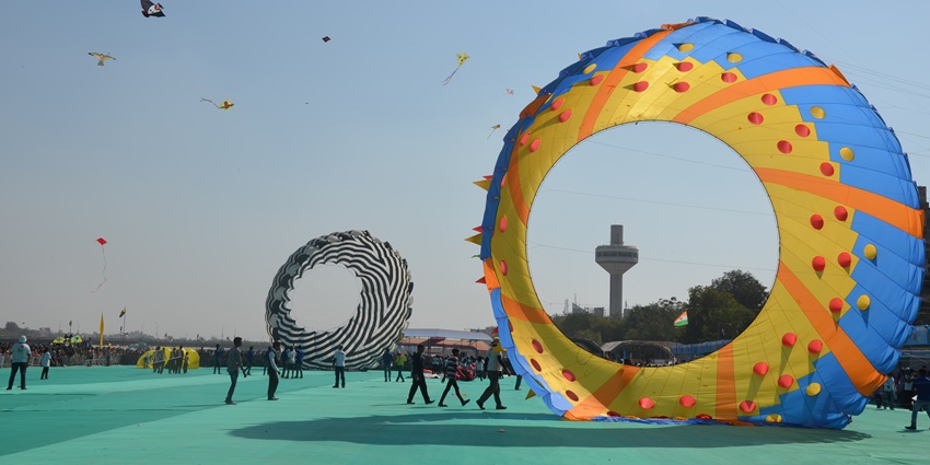 An image of kites being flown during Uttarayan, the harvest festival of Gujarat.