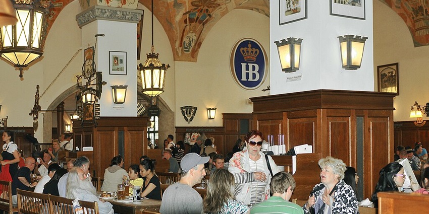 An image of the vibrant crowd and interiors of the Hofbräuhaus at Platzl in Munich