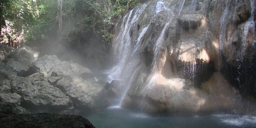 Natural hot springs in a lush mountain setting, perfect for relaxation and rejuvenation