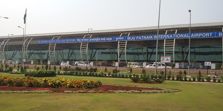 Biju Patnaik International Airport with modern architecture buildings and an Indian flag