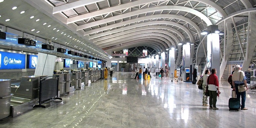 A panoramic view of a state-of-the-art terminal at the airport with an open atrium.