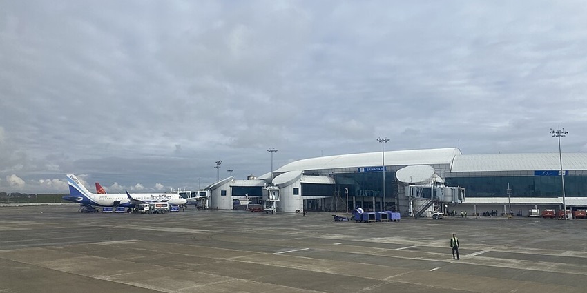 Sheikh Ul-Alam International Airport in Srinagar with an indigo aeroplane parked.