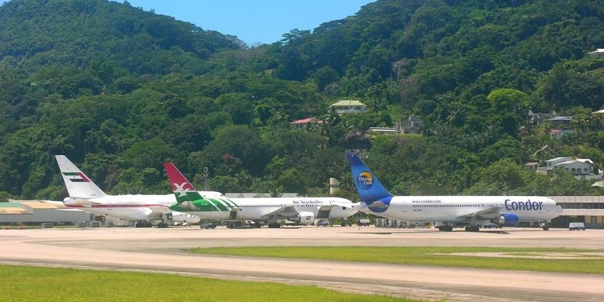 An image of an airport with multiple flights on standby, nearest to Desroches Island