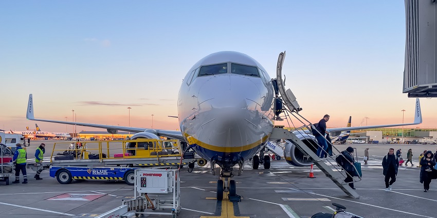 London Stansted Airport Terminal with an airplane in view.