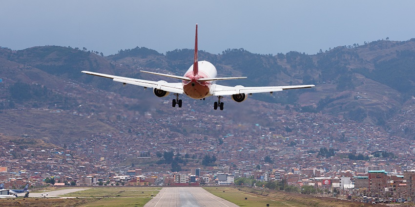 A commercial jet touches down at Alejandro Velasco Astete International Airport, Cusco.