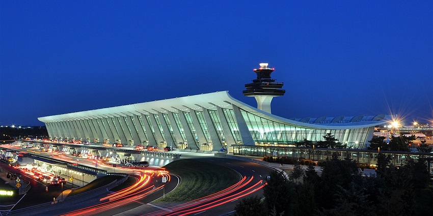 An entrance picture of the Sana’a International Airport in Yemen surrounded by trees.