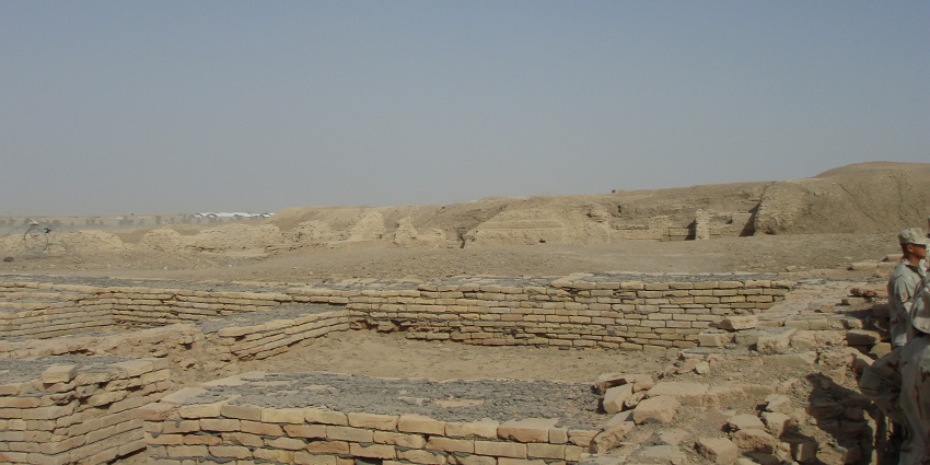 Ruins of Ur in Iraq, featuring ancient brick structures and remnants of a once-thriving city against a clear sky