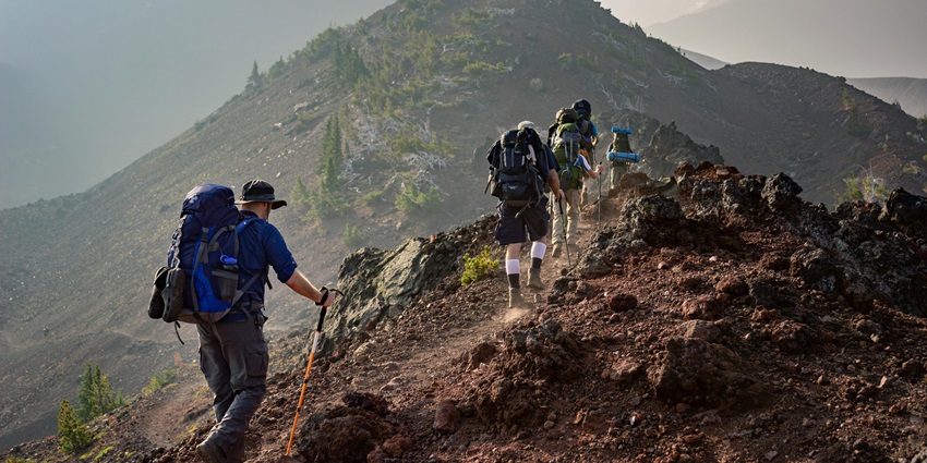 Scenic Image of a group of trekkers, walking up on the hills to reach the Fort