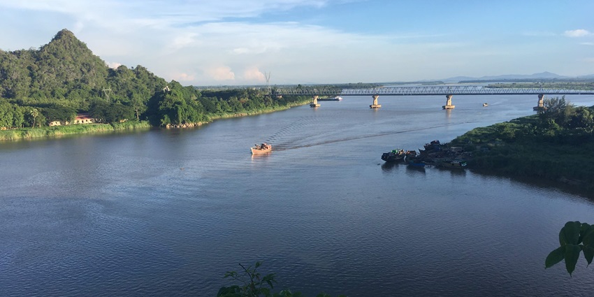 The river flowing in Hpa-An, with lush greenery all around.