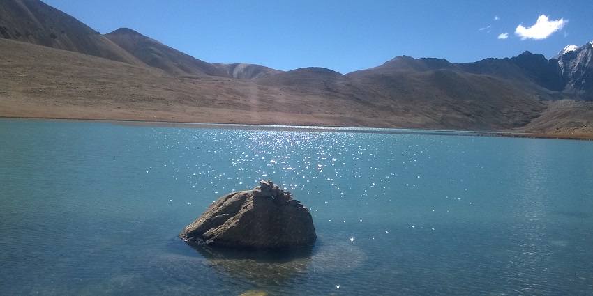 A view of Gurudongmar Lake in April shows pristine waters reflecting the sunlight.
