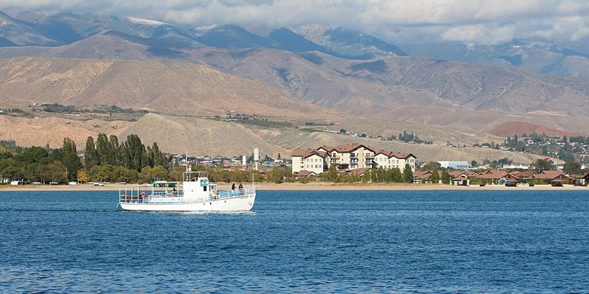 A stunning aerial view of Issyk-Kul Lake, a deep, high-altitude lake in Kyrgyzstan