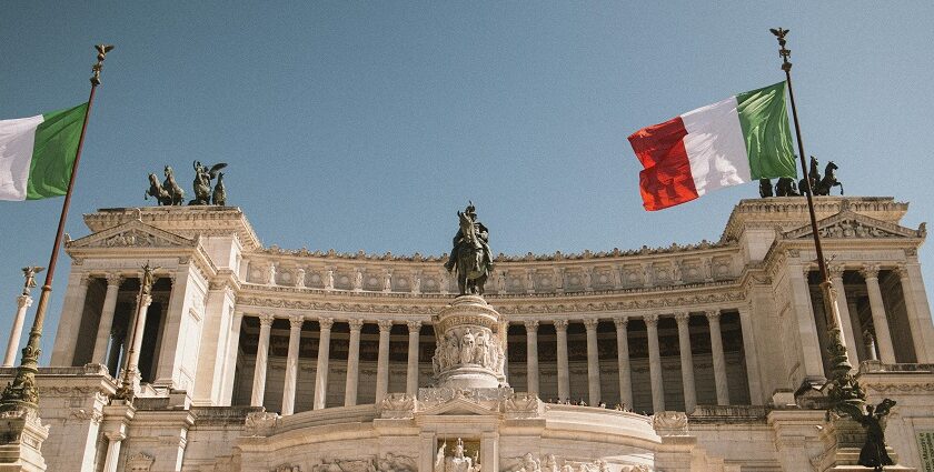 An image of the Monument to Victor Emmanuel II in Rome, Italy, with Italian flags flying.